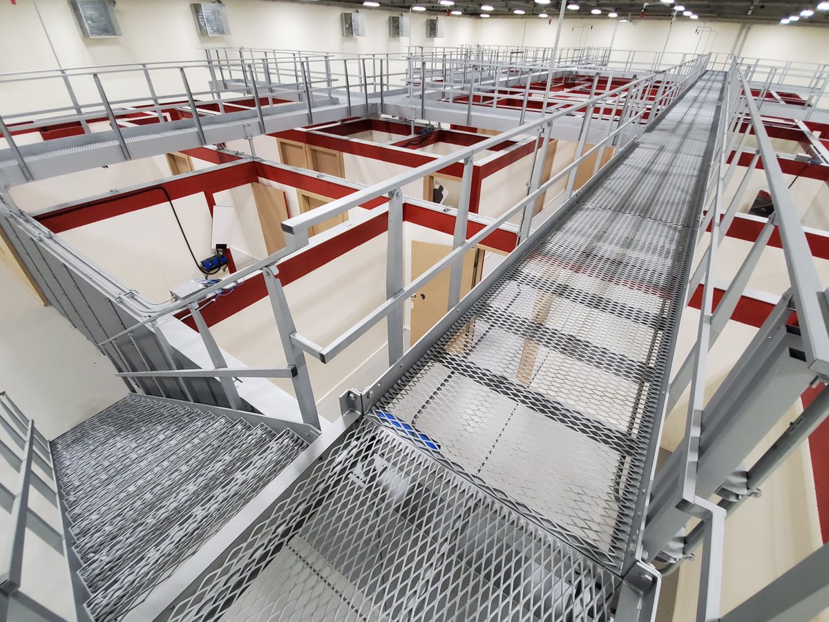 The interior of a MOUT shoot house, its rooms and catwalks seen from above.